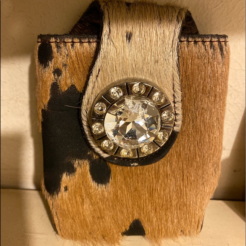 Beautiful cowhide and jeweled bezel case.